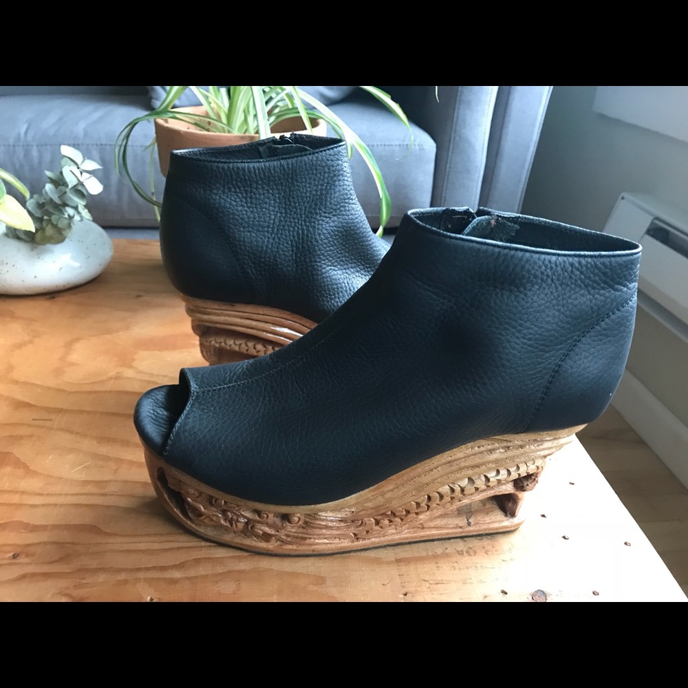 Hand carved platform “dragon” shoes